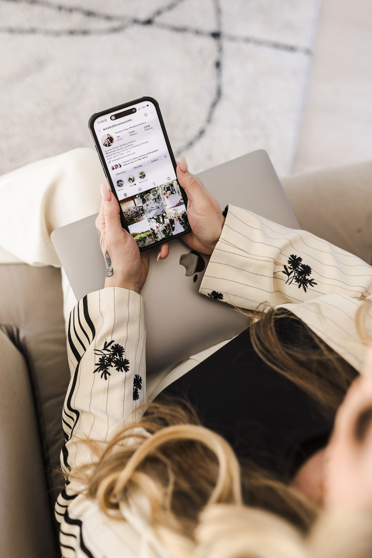 Vendor on phone reviewing Instagram